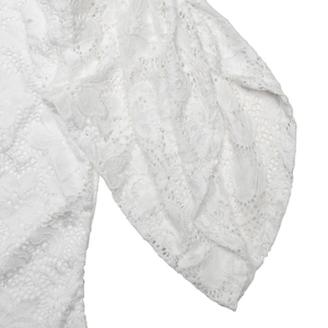 Close-up of white lace sleeve detailing on a slim-fit bodysuit for women