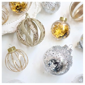 Detailed view of champagne gold Christmas balls with sequins and glitter on white background