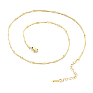 Adjustable golden stainless steel snake chain necklace with beads on white background