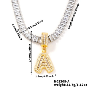 Detailed view of a gold letter A pendant necklace encrusted with zircon stones