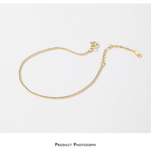 Detailed view of S925 sterling silver golden bead chain bracelet with S925 hallmark
