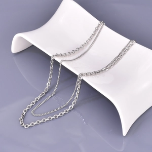 Minimalist double-layer stainless steel chain necklace in silver on white display plate