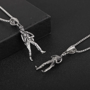 Vintage silver soldier pendant necklace in stainless steel on black textured background