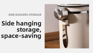 Detail of a side-hanging stainless steel measuring spoon on a matte storage canister