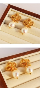 Detailed macro view of vintage twist bow earrings featuring elegant baroque pearls