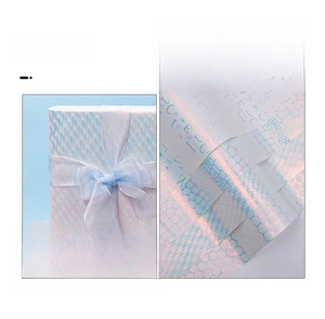 Detail of glitter birthday wrapping paper featuring iridescent textures and honeycomb patterns