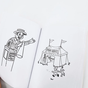 Detail view of the open magic coloring book pages with circus theme line art for kids