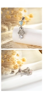 Detail of heart gemstone bell earrings with lace hollow metal and screw back design