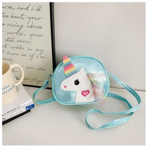 Close-up of light blue unicorn crossbody bag with glitter horn and tulle mane detail