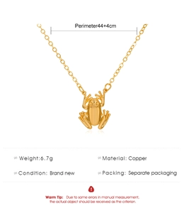 Technical drawing showing a gold frog pendant with 44cm copper chain specifications