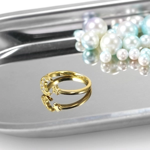 Chic gold moon and star open ring with sparkling crystals on a metal display