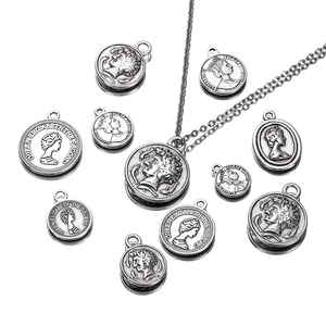Antique silver coin pendant necklace featuring Queen Elizabeth II profile on white background