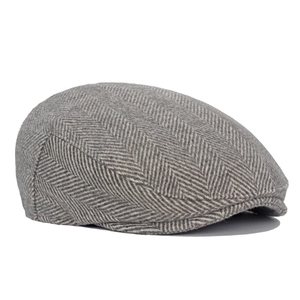 Classic men's grey herringbone wool blend newsboy cap with vintage flat cap silhouette