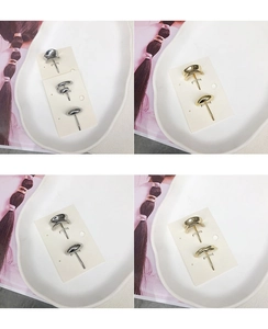Detailed macro view of minimalist gold and silver geometric stud earring sets on cards