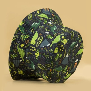 Reversible bucket hat featuring dark corduroy fabric and vibrant cartoon dinosaur prints