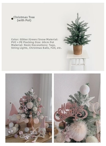 Close-up of 60cm mini Christmas tree with snow-flocked branches and golden glitter accents