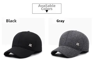 Close-up of winter men's baseball caps in black and grey with warm fleece lining and metal R logo