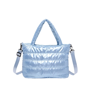 Sky blue quilted padded tote bag with metallic finish and adjustable shoulder strap