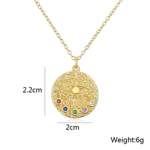 Detail view of 18K gold evil eye pendant showing 2cm diameter and zirconia inlay