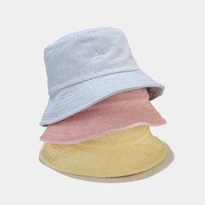 Three-piece set of embroidered terry cloth bucket hats in light blue, pink and yellow