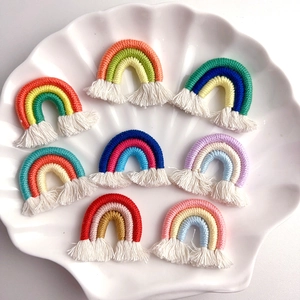 Handmade macrame rainbow pendants with tassels set of 8 in a white shell dish