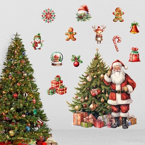 Close-up of Santa Claus and snowman wall decals on a neutral gray textured background