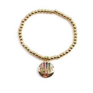 Gold beaded bracelet featuring a round star pendant with colorful crystals on white background