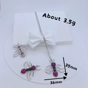 Three insect ant-shaped pendants in copper with zircons and silver chain necklaces