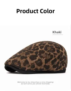 Detail of khaki leopard print beret hat showing knitted texture and black brim trim