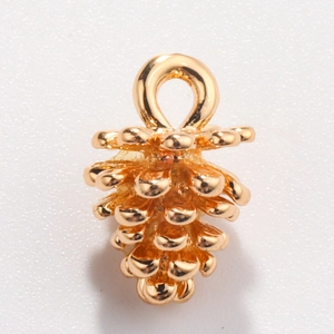 Detailed view of a golden pine cone pendant with a top ring for DIY jewelry making
