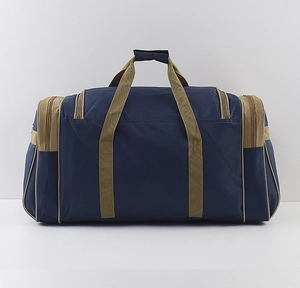 Detail of blue waterproof travel bag with khaki handles and side zipper pockets