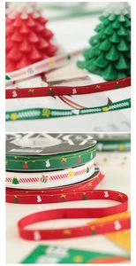 Detail of festive Christmas ribbons with holiday patterns and gold stitching for gift wrapping