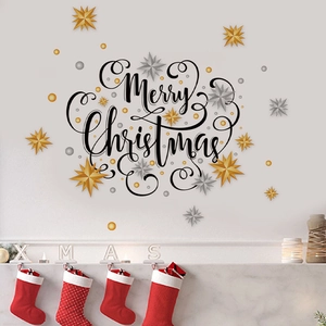 Detail of gold Merry Christmas wall decal with 3D star stickers and festive socks decoration