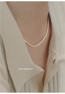 Close-up of 2mm dainty freshwater pearl choker necklace with 14K gold-filled details