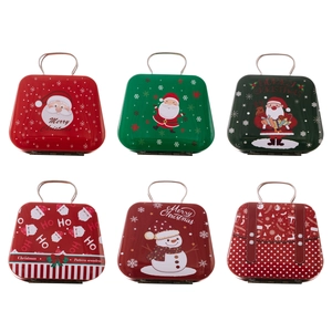 Set of six Christmas tinplate mini suitcases with assorted festive patterns and handles