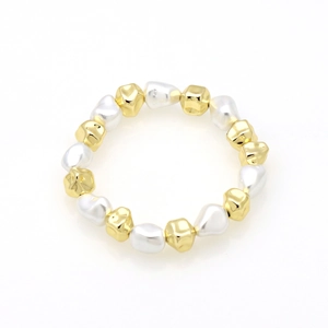 Detailed macro view of 18k gold-plated irregular beads and elegant baroque pearls