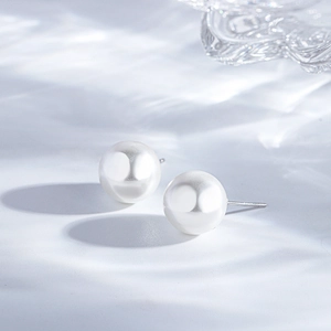 Detail showing high-quality white round pearl earrings with S925 sterling silver stamp