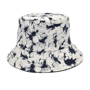 Close-up of tie-dye bucket hat featuring thick cotton canvas and reinforced brim stitching