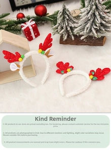 Close-up of festive Christmas reindeer headbands with red antlers and white plush texture
