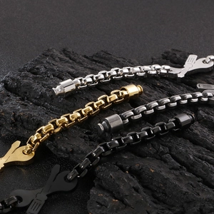 Detail of wrench and screwdriver charms on industrial square link bracelets in four metal tones