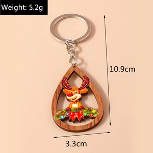 Détail du porte-clés renne en bois montrant la longueur de 10,9cm et le poids de 5,2g