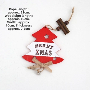 Detailed view of red and white wooden Christmas tree ornament with Merry Xmas engraving