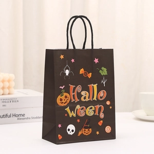 Halloween gift bag in black kraft paper with festive pumpkin and spider prints