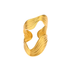 Macro shot of 18K gold plated ring featuring irregular fluid wave textures and stripes