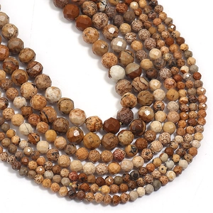 Detailed close-up of faceted natural stone beads in earthy brown and beige tones