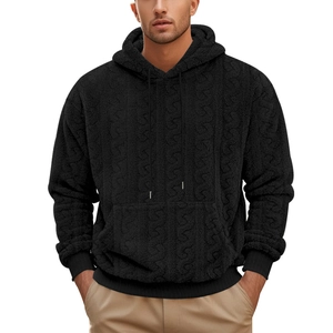 Detailed view of black cable knit teddy fleece texture on men's hooded sweatshirt