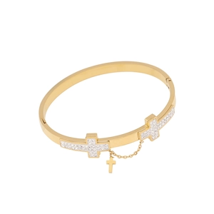 Gold stainless steel open cuff bracelet with sparkling zircon cross charms on white background
