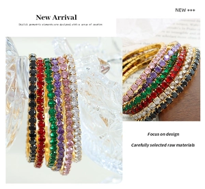 Detail of 18K gold plated elastic bracelet featuring multi-color zircon stones set in gold