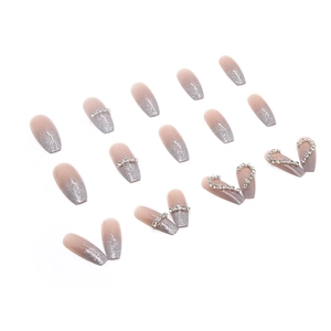 Long ballerina press-on nails with nude gradient glitter and heart rhinestone accents