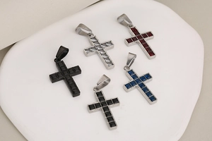 Detailed close-up of hip hop stainless steel cross pendants in five assorted colors